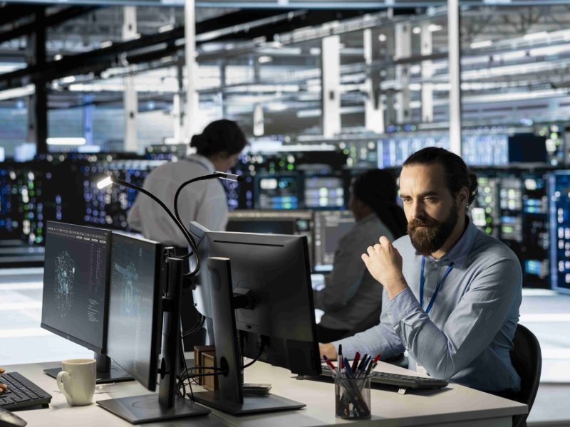 technician-using-pc-data-center-update-server-tech-configuring-equipment (1)_11zon